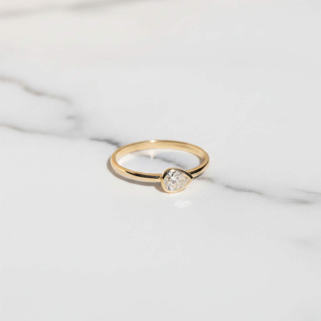 East West Pear Bezel Set Solitaire Ring | Lab Grown Diamond | 14K Yellow Gold Minimalist