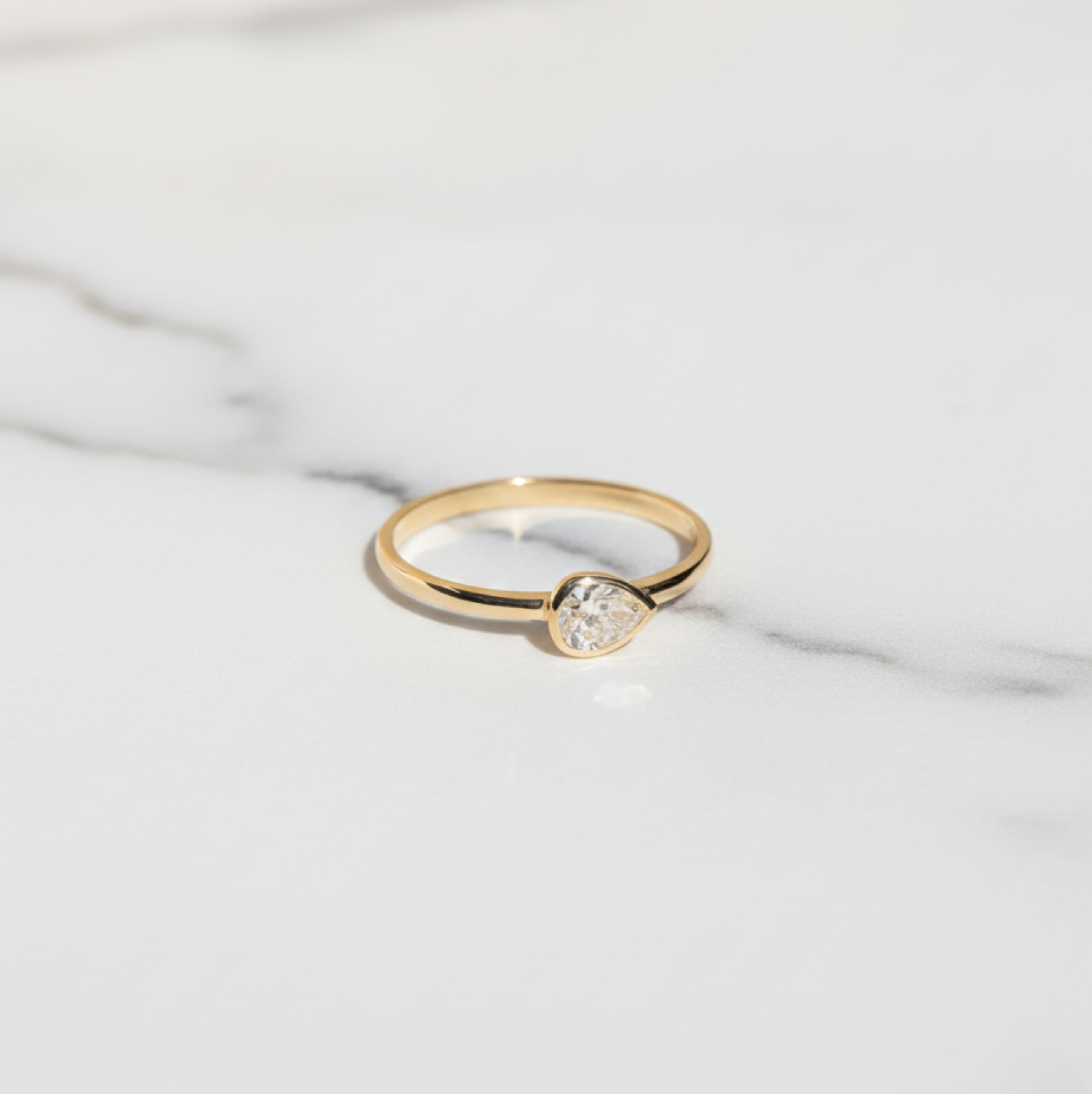 East West Pear Bezel Set Solitaire Ring | Lab Grown Diamond | 14K Yellow Gold Minimalist