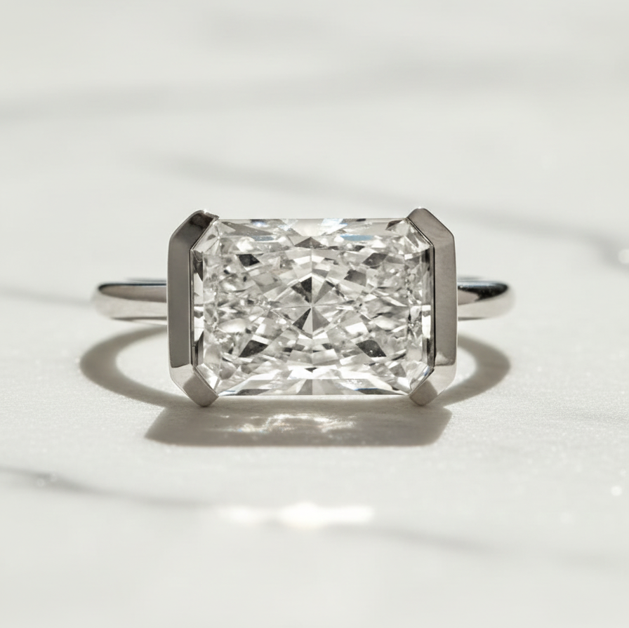 Modern East West Radiant Engagement Ring | Lab Grown Diamond | 14K Yellow Gold Half Bezel