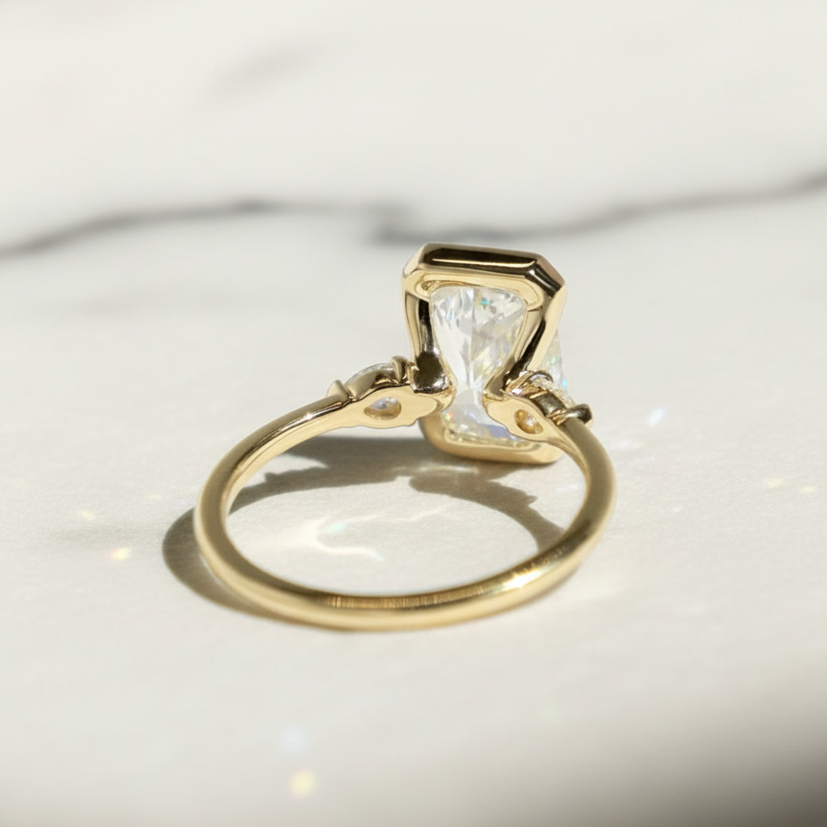 Radiant 3 Stone Engagement Ring with Pear Accent Half Bezel | Lab Grown Diamond | 14K Yellow Gold