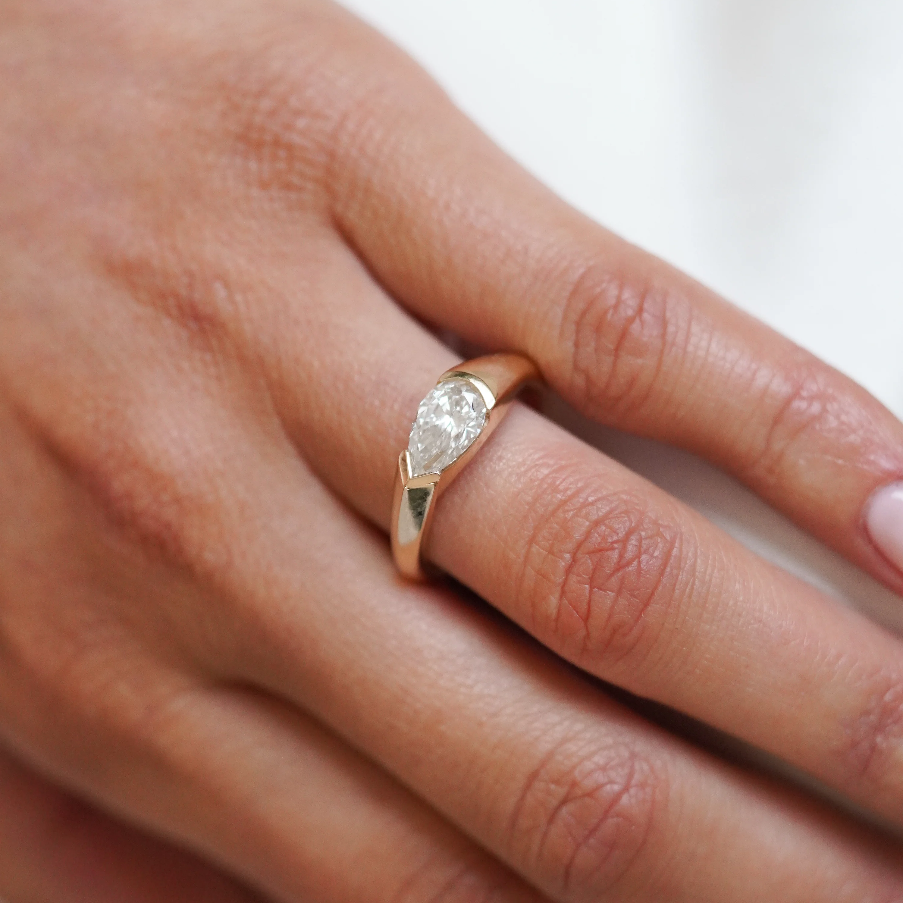 East West Half Bezel Pear Engagement Ring | Lab Grown Diamond | 14K Yellow Gold Modern Solitaire