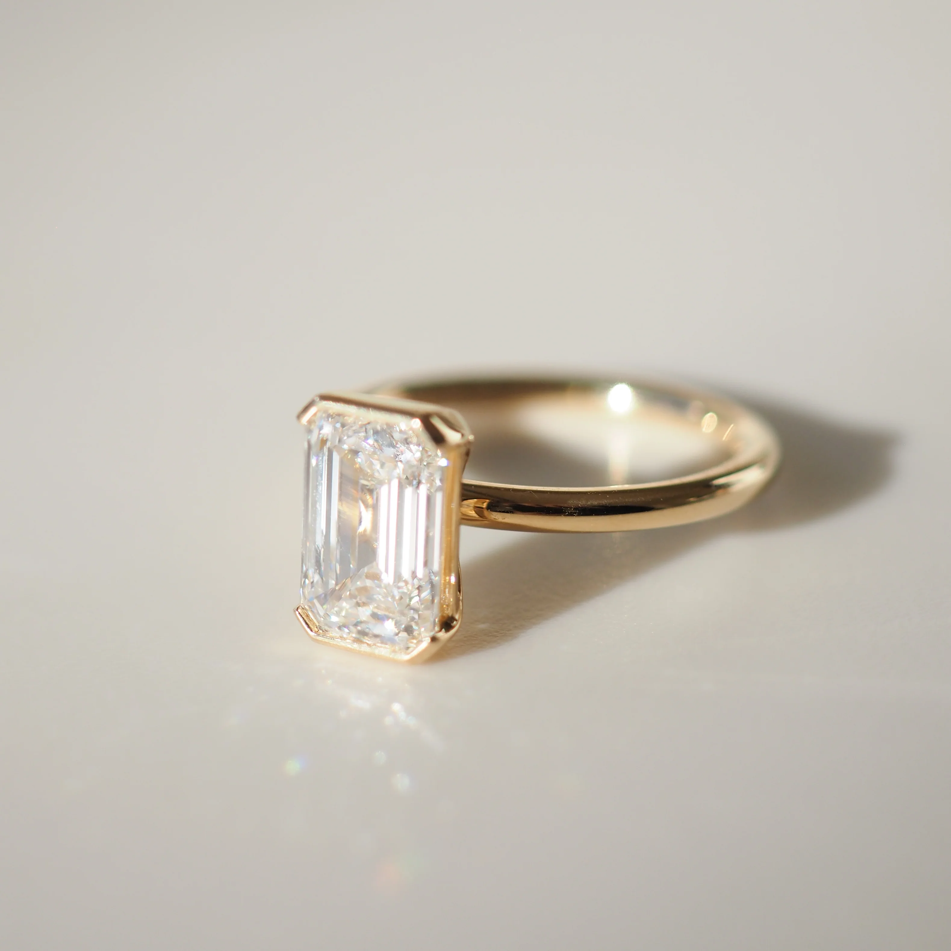 Elegant Half Bezel Emerald Solitaire Engagement Ring | Lab Grown Diamond | 14K Yellow Gold Everyday Ring